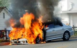 Car on fire in street